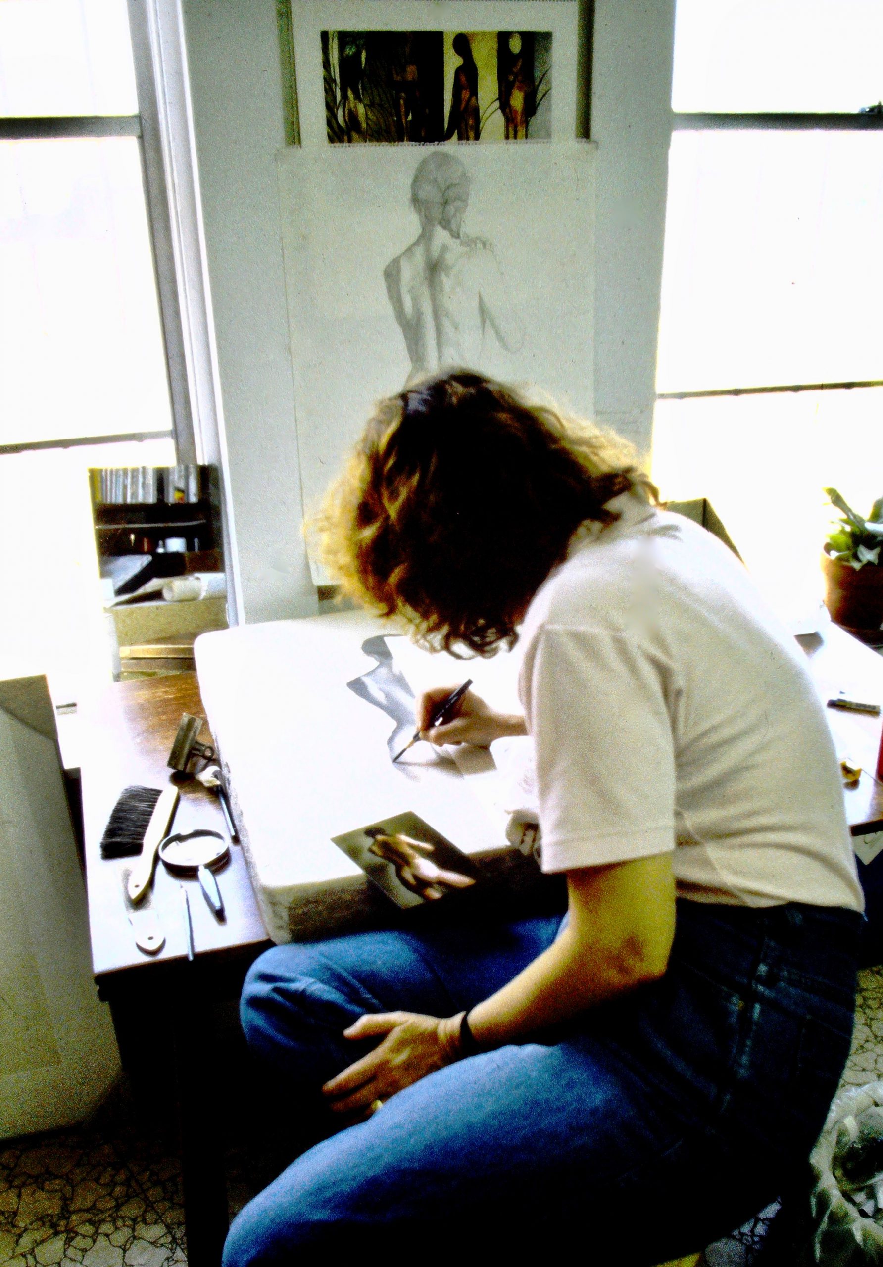Image of the artist working on a lithograph
