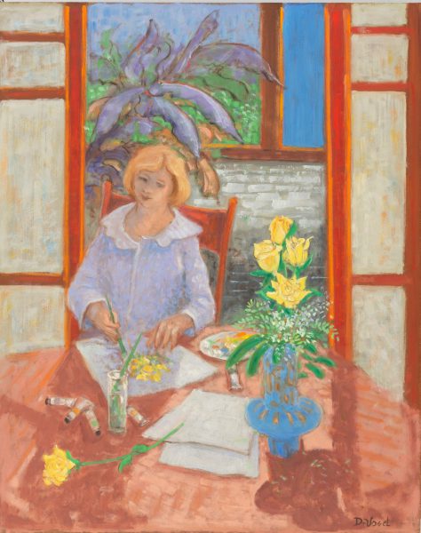 Lady seated at a table painting