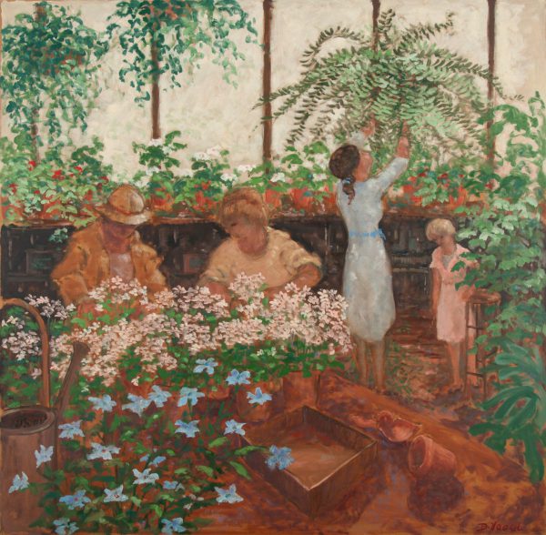 Three adults and one child standing in a greenhouse
